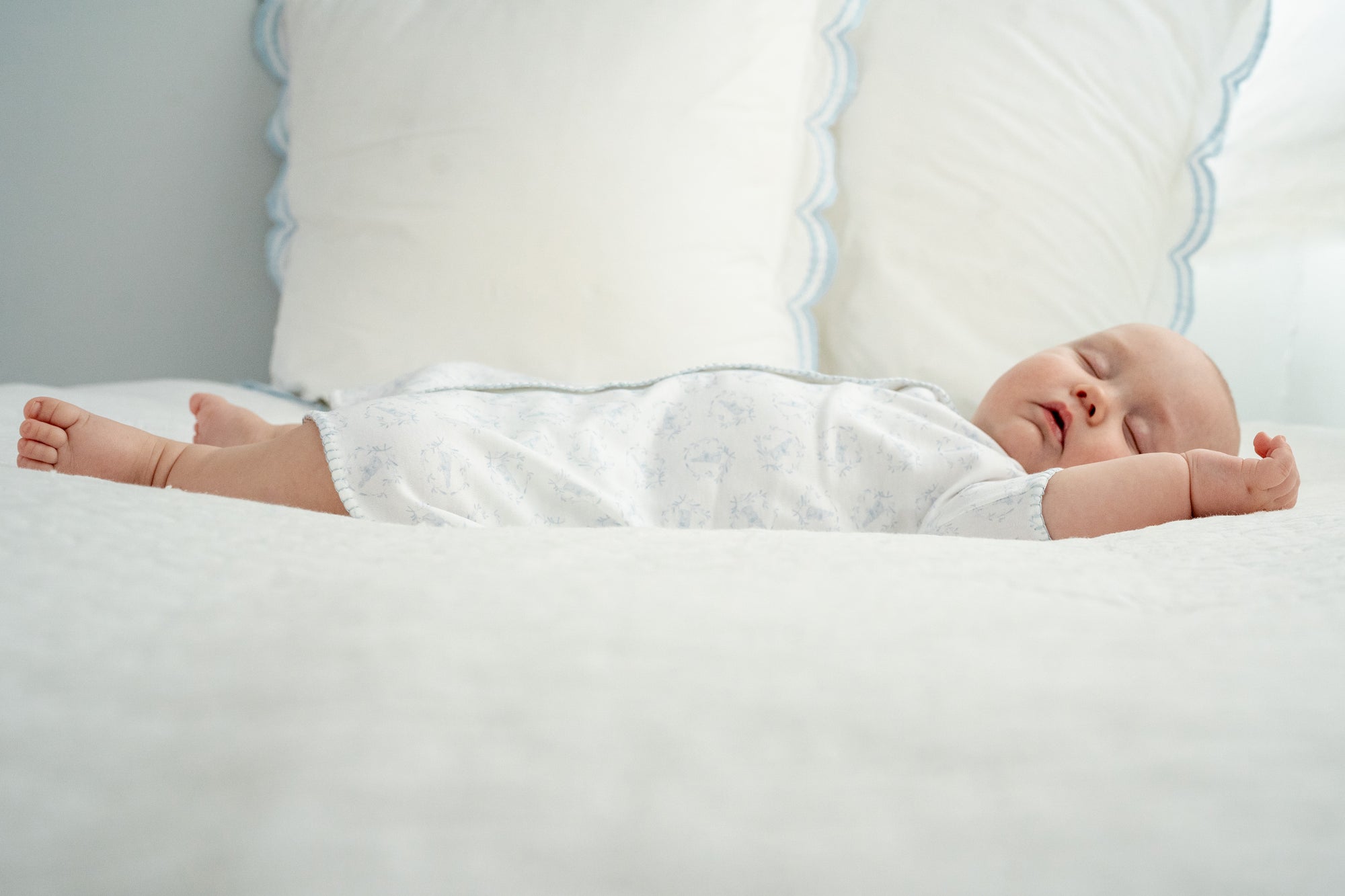 HIGH DEFINITION Riley snoozing on bed in blue day gown